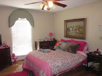 500 Normandy Tullahoma Road Normandy, TN 37360 - Photo 13 of 26 a bedroom with a bed and a chandelier