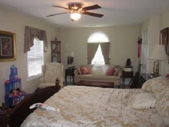 500 Normandy Tullahoma Road Normandy, TN 37360 - Photo 20 of 26 a bedroom with a bed and a chandelier