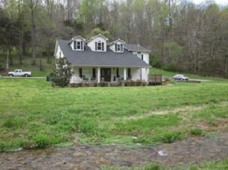500 Normandy Tullahoma Road Normandy, TN 37360 - Photo 3 of 26 a front view of a house with garden