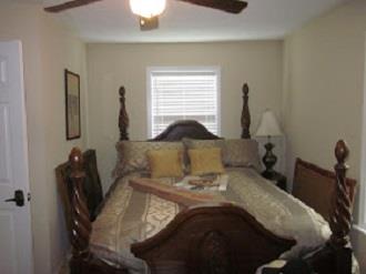 500 Normandy Tullahoma Road Normandy, TN 37360 - Photo 22 of 26 a bed sitting in a room next to a window