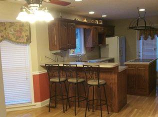 500 Normandy Tullahoma Road Normandy, TN 37360 - Photo 7 of 26 a kitchen with stainless steel appliances kitchen island granite countertop a table chairs and a refrigerator