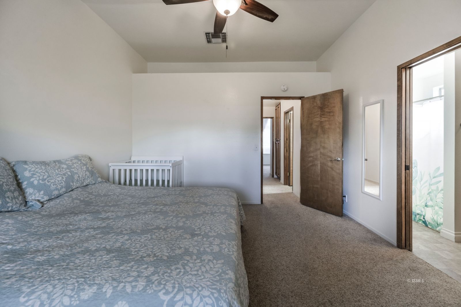 404 Veada Avenue Ridgecrest, CA 93555 - Photo 25 of 33 a view of a bedroom with a ceiling fan