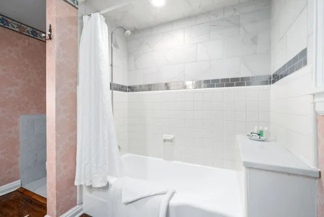 a bathroom with a sink and a shower