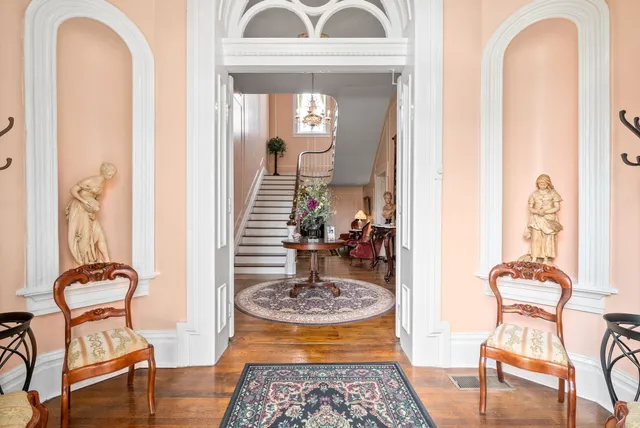 a view of a livingroom with furniture and front door