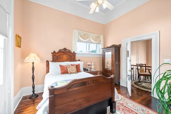 a living room with furniture a rug and a fireplace