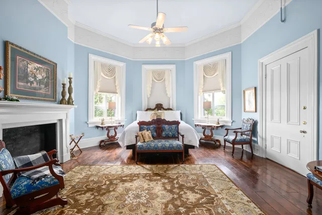 a bathroom with a bathtub a sink and a window
