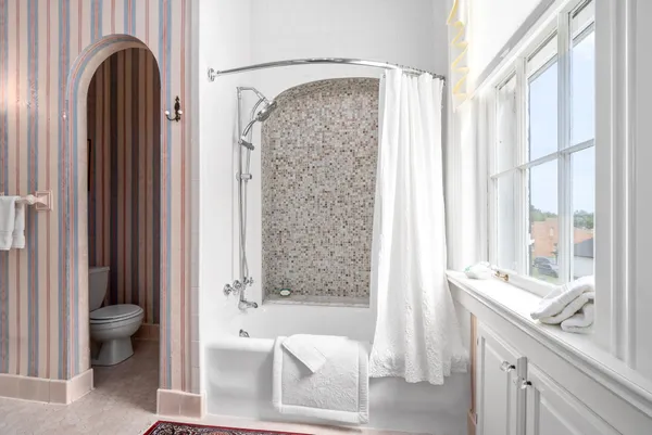 a living room with furniture and a rug