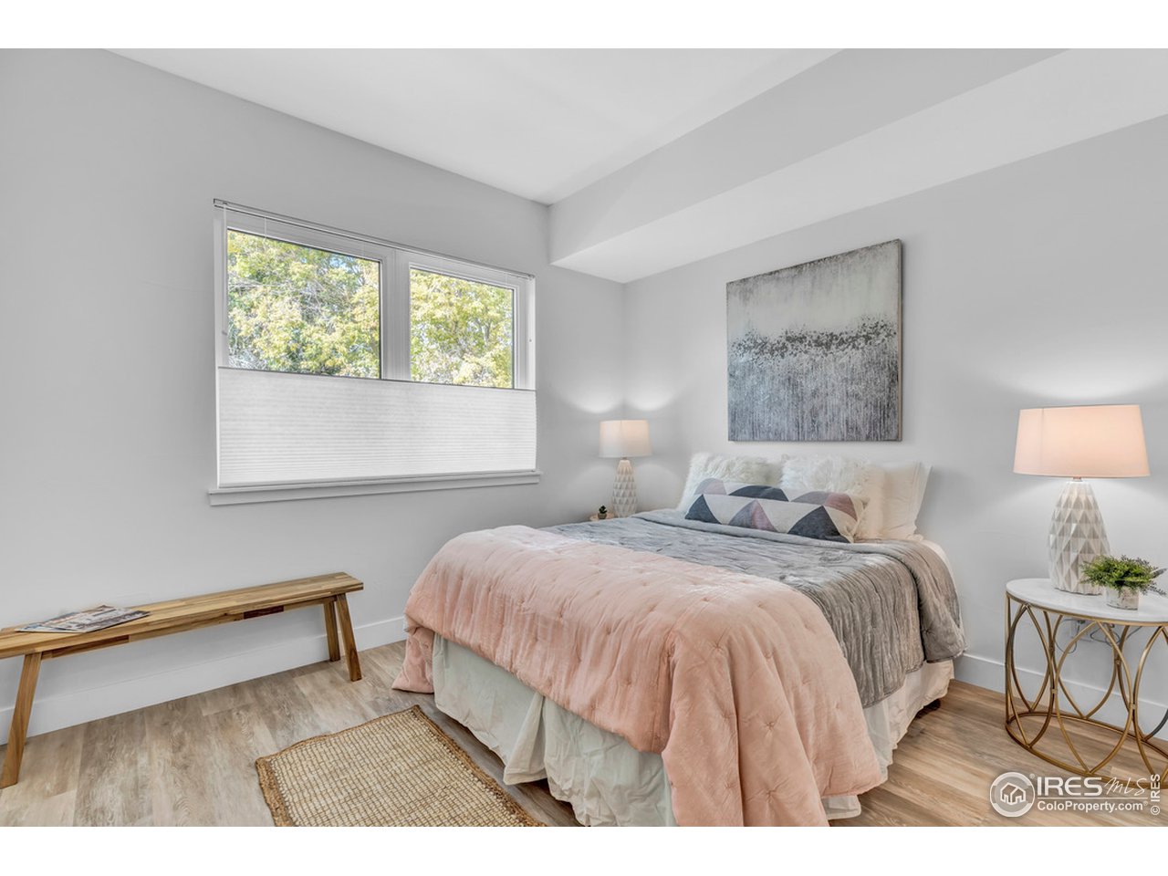 3261 Airport Road, Unit 204 Boulder, CO 80301 - Photo 16 of 36 a bedroom with a bed and a night stand