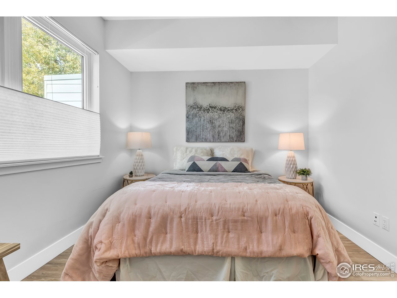 3261 Airport Road, Unit 204 Boulder, CO 80301 - Photo 17 of 36 a bedroom with a bed and a night stand