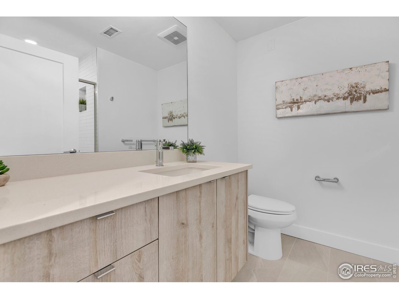 3261 Airport Road, Unit 204 Boulder, CO 80301 - Photo 18 of 36 a bathroom with a sink toilet and a mirror
