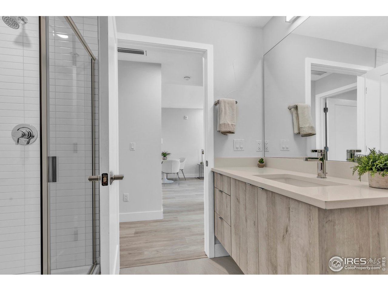 3261 Airport Road, Unit 204 Boulder, CO 80301 - Photo 19 of 36 a bathroom with a sink vanity granite tub shower and a mirror