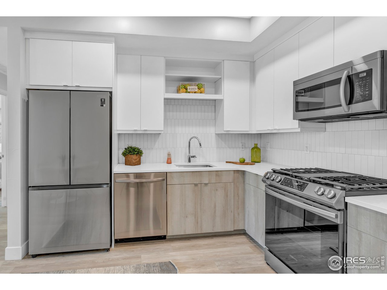 3261 Airport Road, Unit 204 Boulder, CO 80301 - Photo 5 of 36 a kitchen with stainless steel appliances a stove a microwave and refrigerator