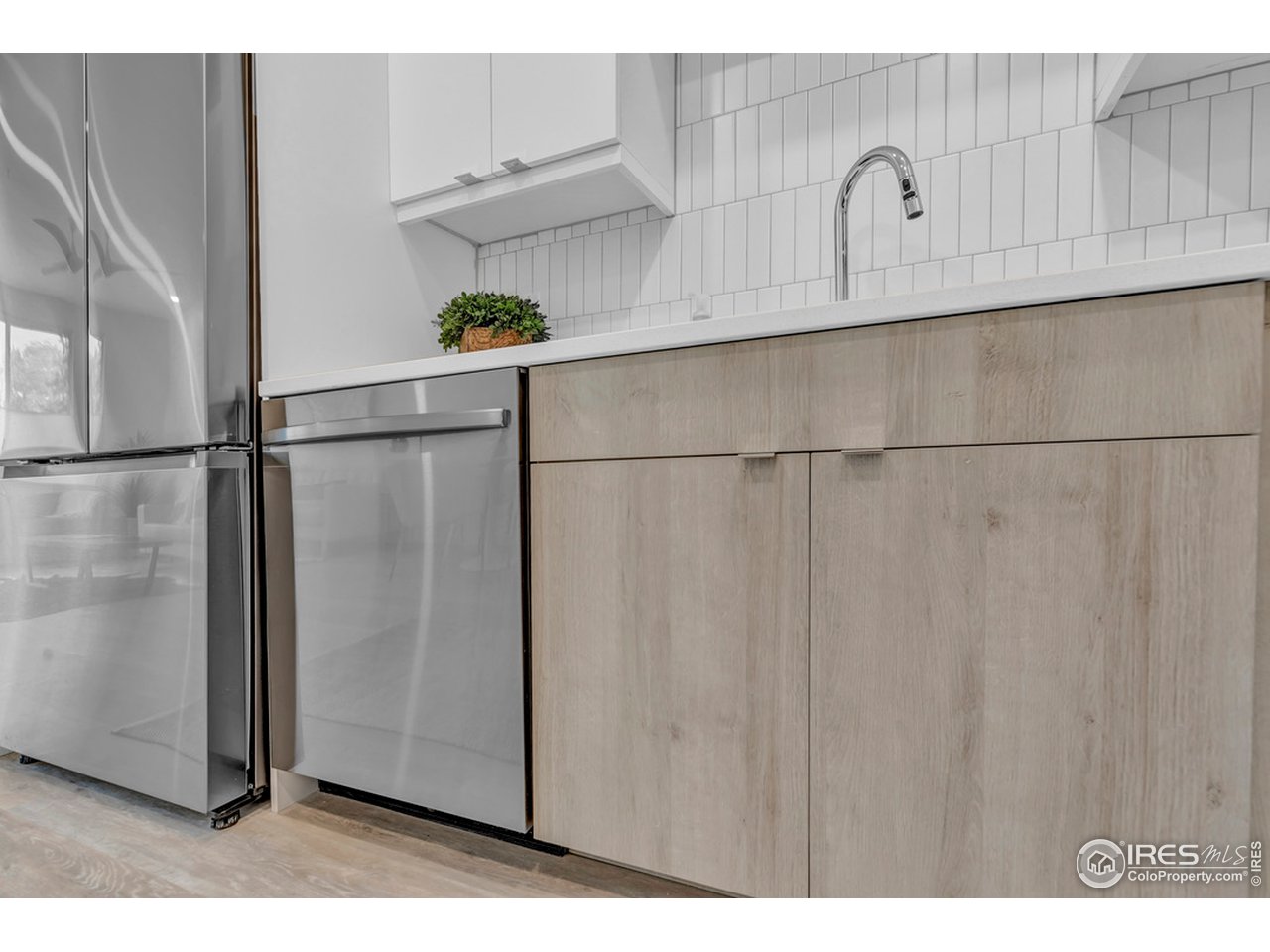 3261 Airport Road, Unit 204 Boulder, CO 80301 - Photo 7 of 36 a close view of a refrigerator in kitchen and white cabinets
