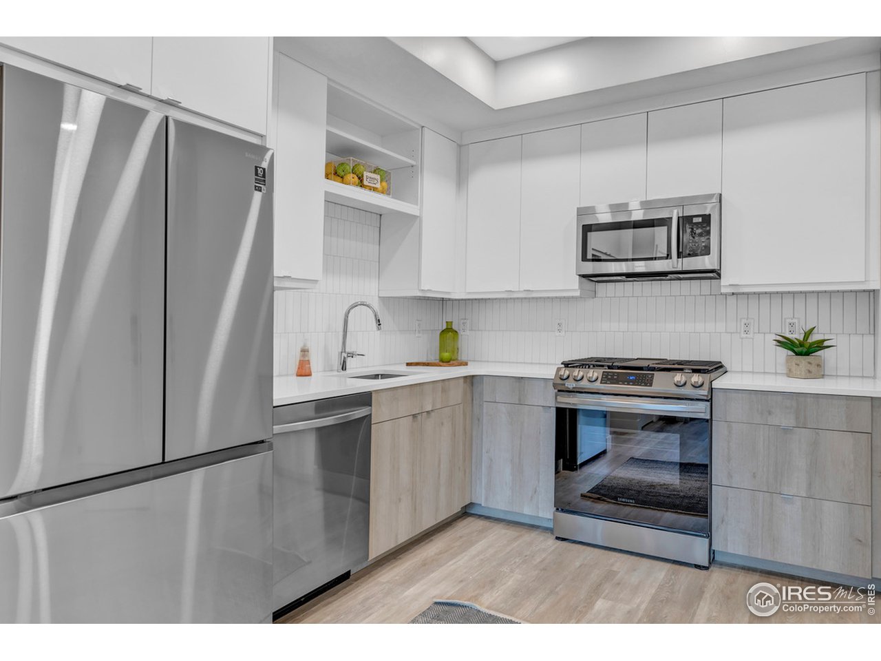 3261 Airport Road, Unit 204 Boulder, CO 80301 - Photo 8 of 36 a kitchen with stainless steel appliances a stove a sink and a refrigerator