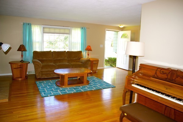 59 Joyce Road Framingham, MA 01701 - Photo 14 of 30 a living room with furniture and a lamp