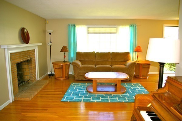 59 Joyce Road Framingham, MA 01701 - Photo 15 of 30 a living room with furniture and a fireplace