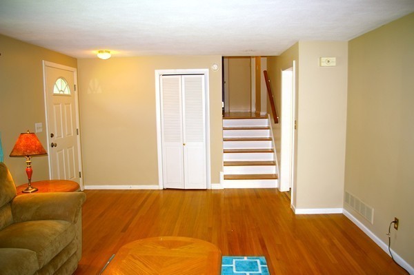 59 Joyce Road Framingham, MA 01701 - Photo 16 of 30 a bedroom with a bed and wooden floor