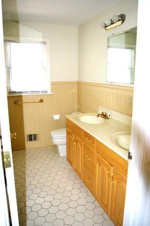 59 Joyce Road Framingham, MA 01701 - Photo 22 of 30 a bathroom with a sink a toilet and mirror