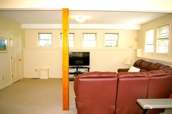 59 Joyce Road Framingham, MA 01701 - Photo 23 of 30 a living room with furniture and a flat screen tv
