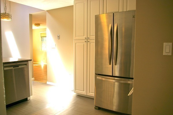 59 Joyce Road Framingham, MA 01701 - Photo 9 of 30 a view of a refrigerator in a kitchen