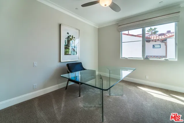 a workspace with furniture and window