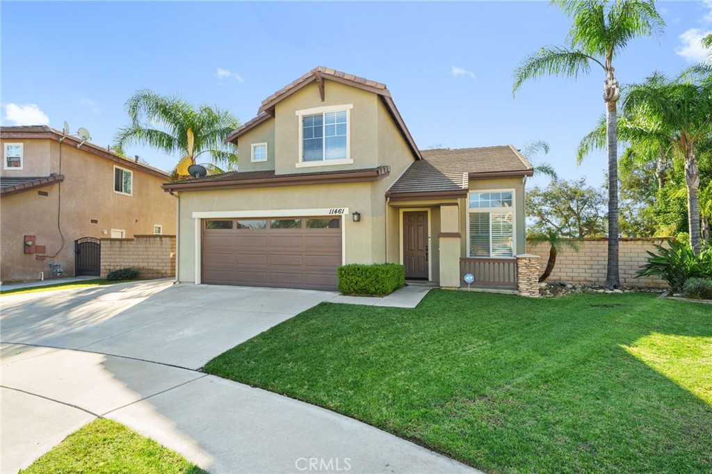 11461 Fallingstar Court Rancho Cucamonga, CA 91701 - Photo 1 of 1 a front view of a house with a yard and garage