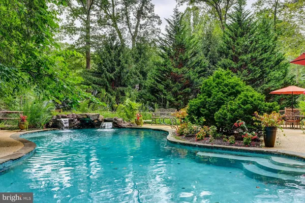 a view of a garden with a sitting area