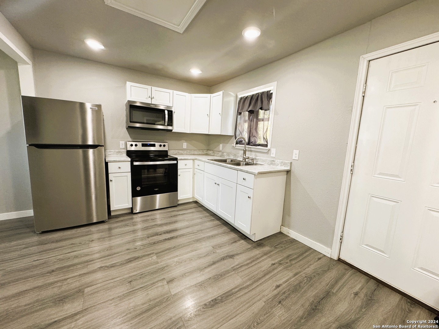 1914 Cupples Road San Antonio, TX 78226 - Photo 4 of 6 a kitchen with stainless steel appliances a refrigerator sink and microwave