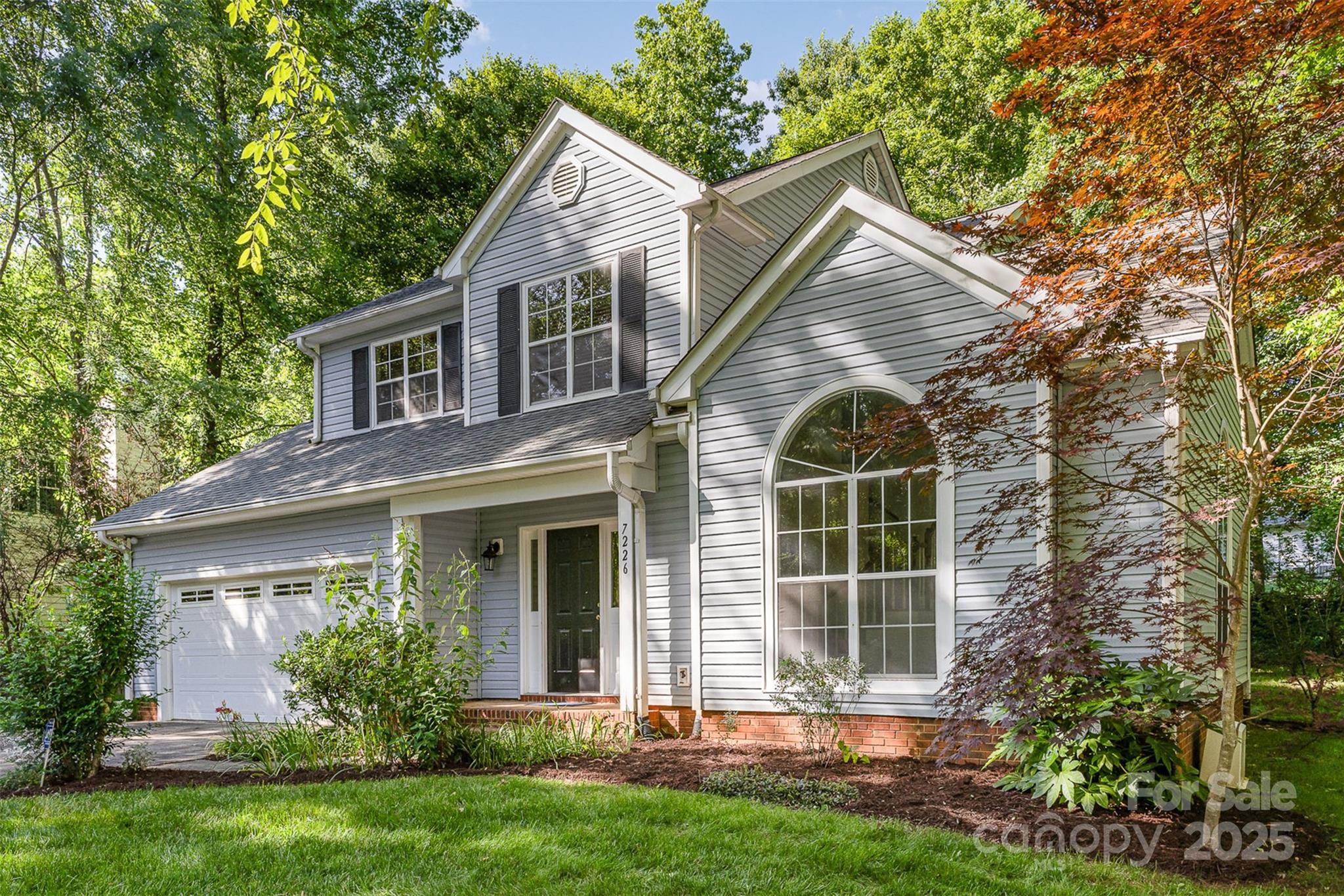 7226 Reedy Creek Road Charlotte, NC 28215 - Photo 4 of 37 front view of a house with a yard