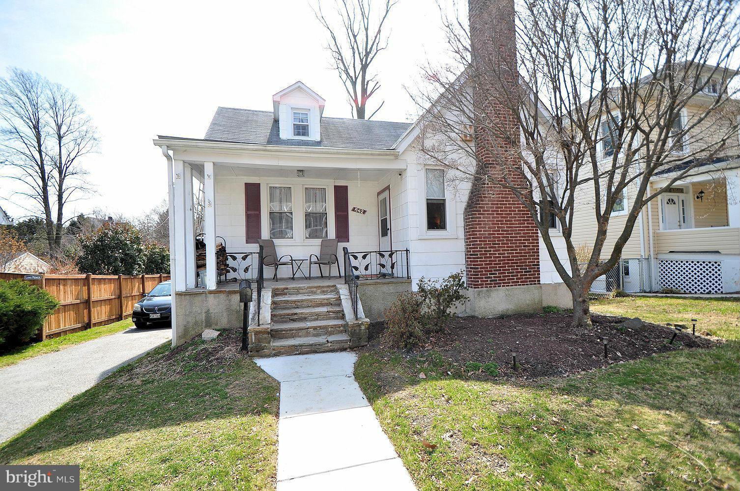 642 Coleraine Road Baltimore, MD 21229 - Photo 1 of 26 a view of a house with backyard porch and sitting area