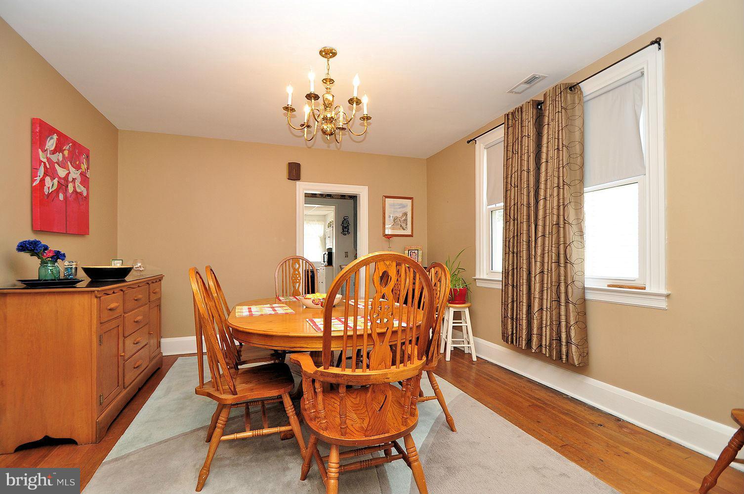 642 Coleraine Road Baltimore, MD 21229 - Photo 11 of 26 a view of a dining room with furniture window and wooden floor