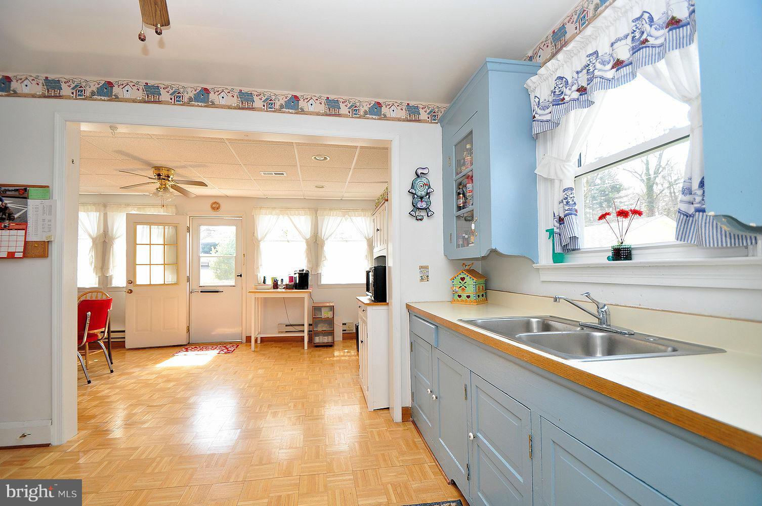 642 Coleraine Road Baltimore, MD 21229 - Photo 15 of 26 a large white kitchen with a large window