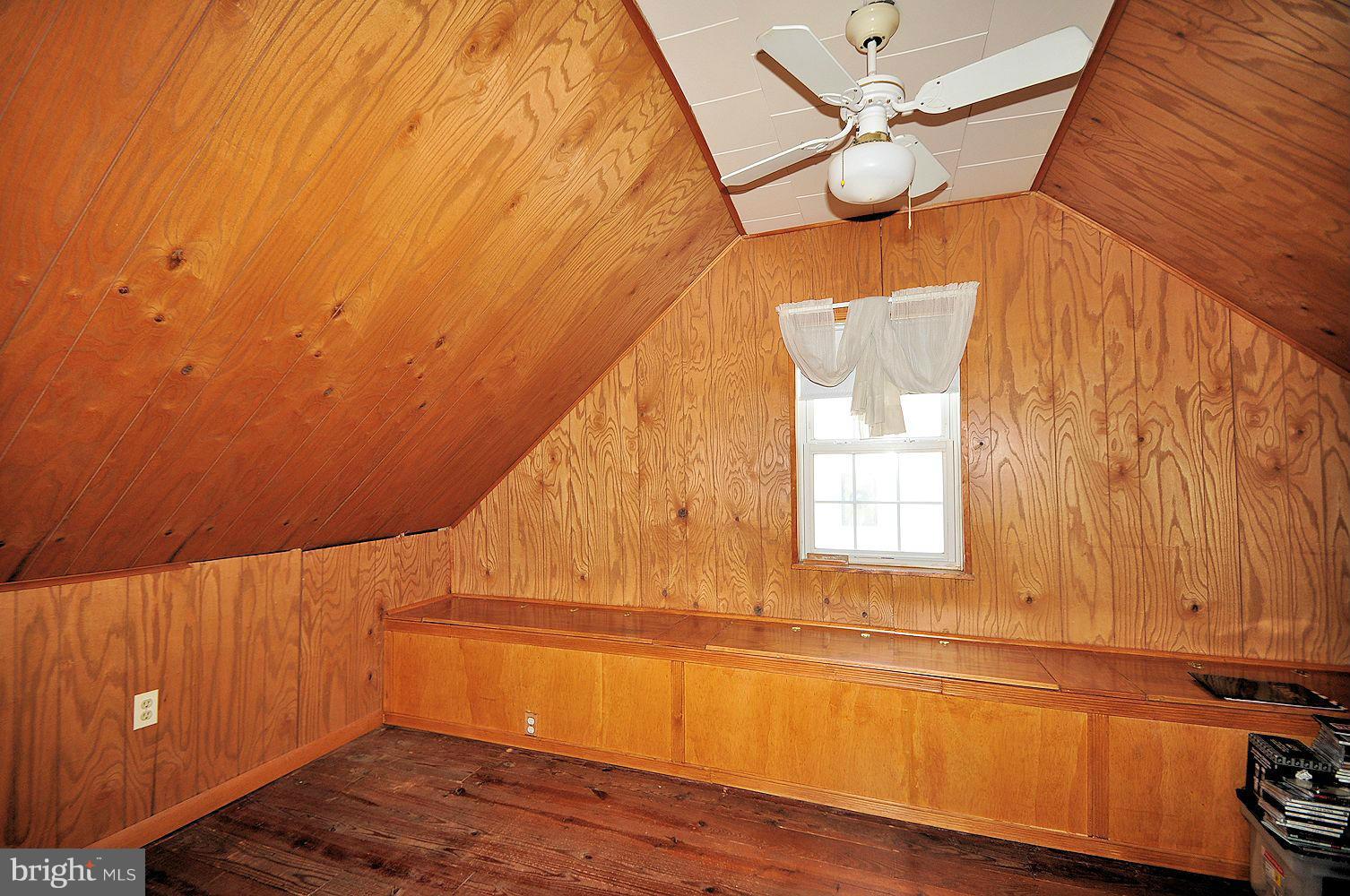 642 Coleraine Road Baltimore, MD 21229 - Photo 24 of 26 a view of an empty room with a window and wooden floor