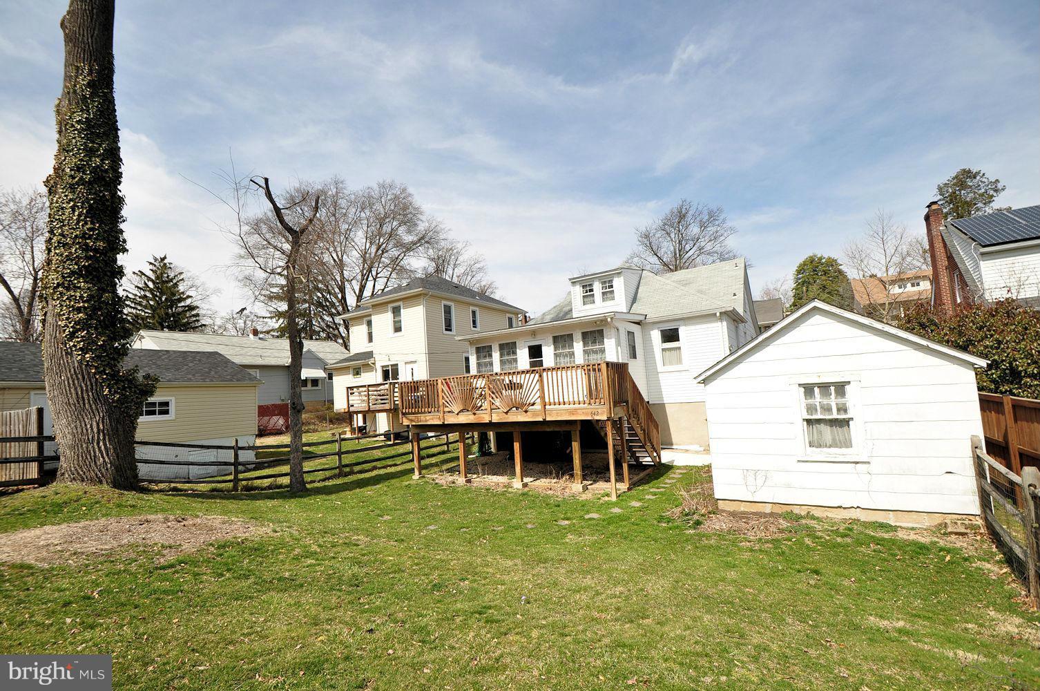 642 Coleraine Road Baltimore, MD 21229 - Photo 4 of 26 a front view of a house with a yard
