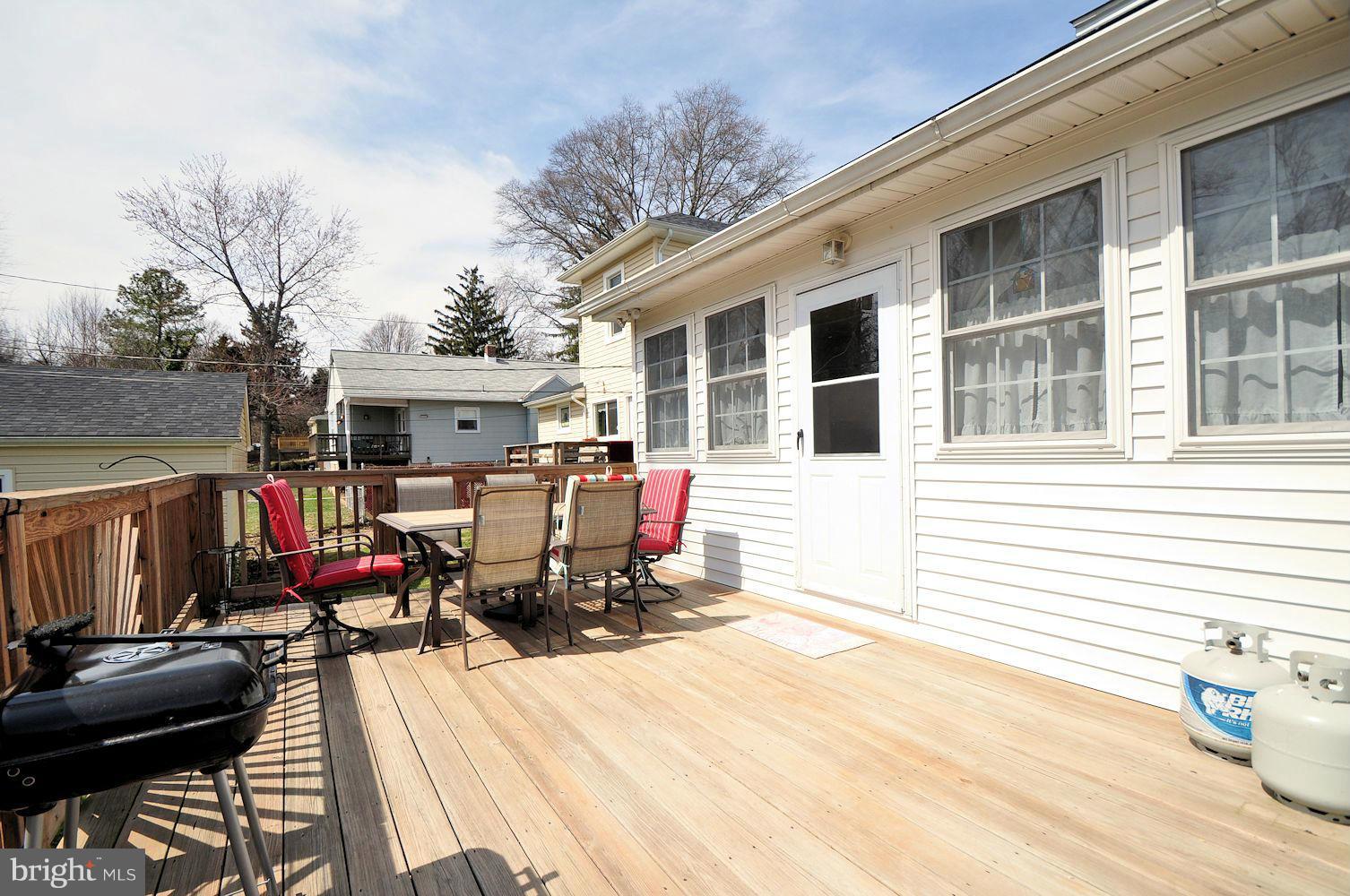 642 Coleraine Road Baltimore, MD 21229 - Photo 6 of 26 a view of a patio with couches chairs and wooden floor