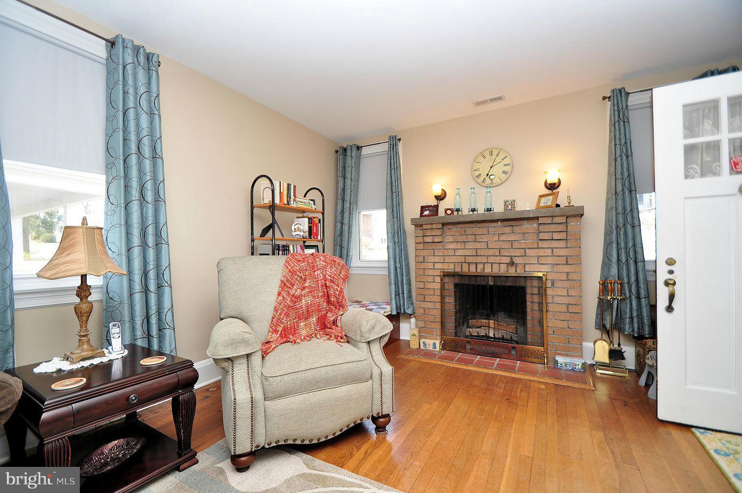 642 Coleraine Road Baltimore, MD 21229 - Photo 9 of 26 a living room with furniture and a fireplace