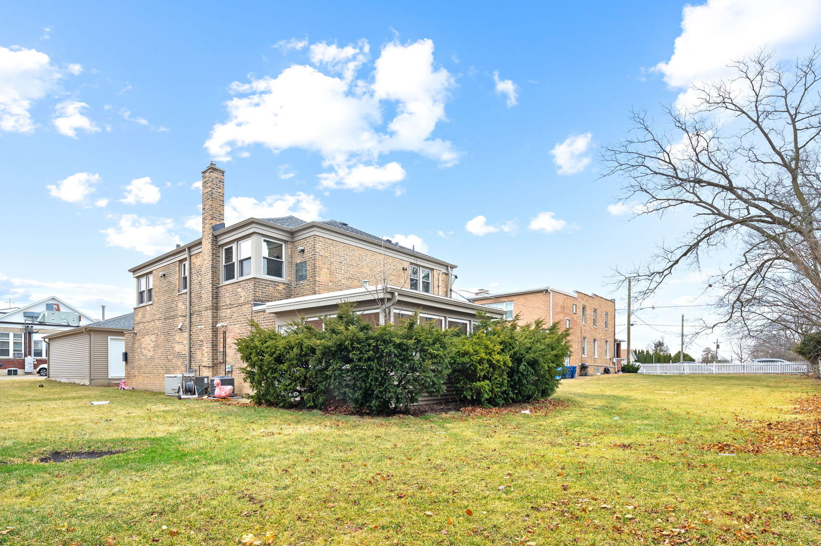 423 Funston Avenue, Unit 1R Highwood, IL 60040 - Photo 12 of 13 a front view of a house with a yard and lake view
