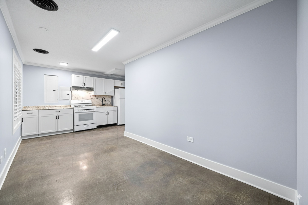423 Funston Avenue, Unit 1R Highwood, IL 60040 - Photo 3 of 13 a view of a kitchen with white cabinets and wooden floor