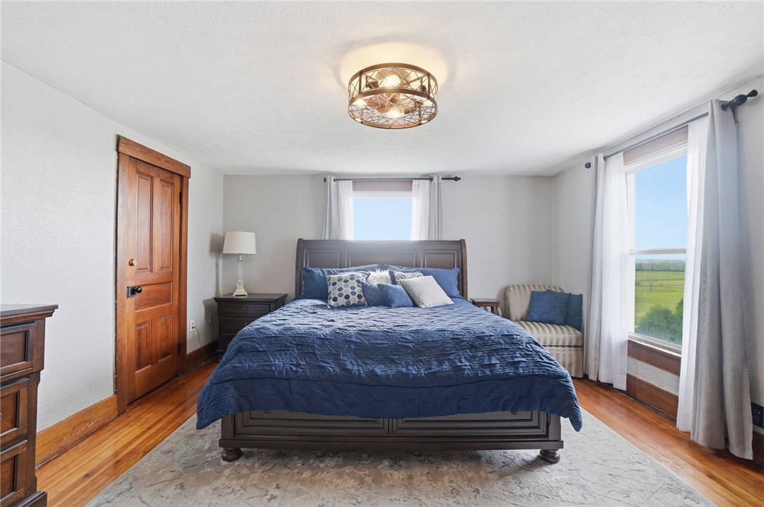 6155 North Union Road Clayton, OH 45315 - Photo 30 of 59 This peaceful bedroom offers ample light and views of green pastures.