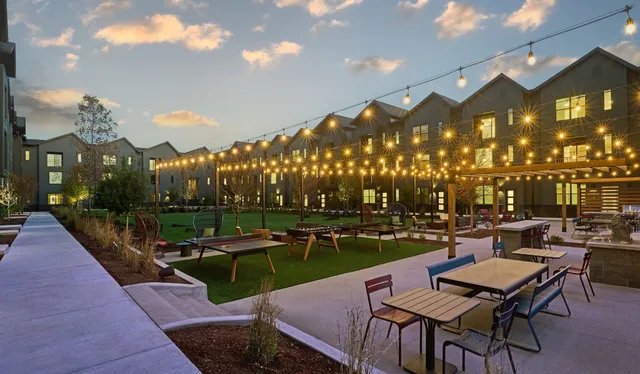 a view of a patio with a table and chairs
