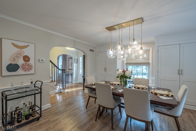 200 Wychwood Road Westfield, NJ 07090 - Photo 8 of 31 a view of a dining room with furniture a chandelier and wooden floor