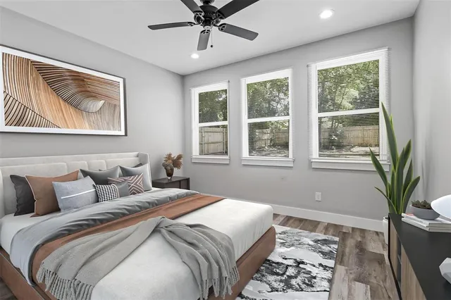 a bedroom with bed and a window