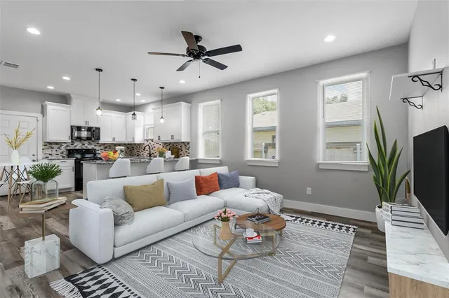 a living room with furniture and a flat screen tv