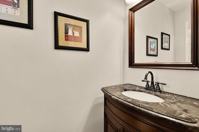 a view of a hallway with furniture
