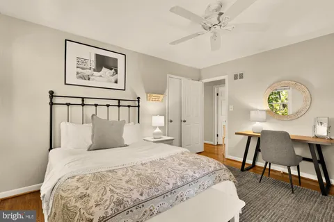 a bedroom with a bed and flat screen tv