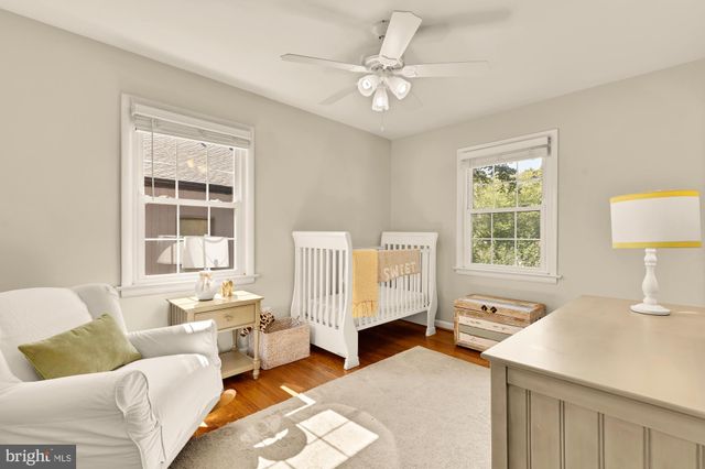 a spacious bedroom with a bed and a window