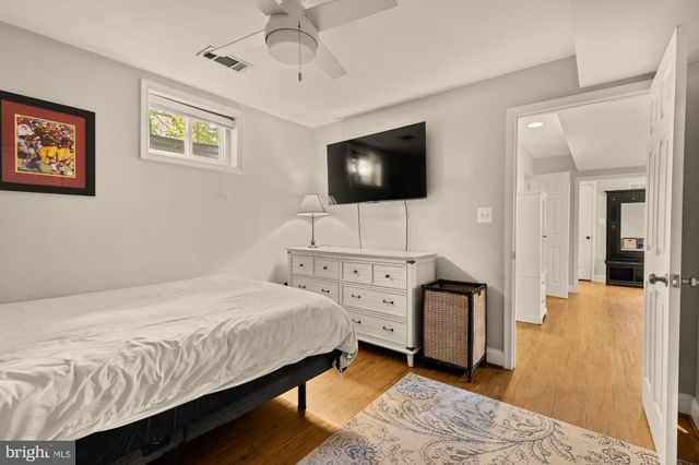 a utility room with dryer washer and a view of kitchen