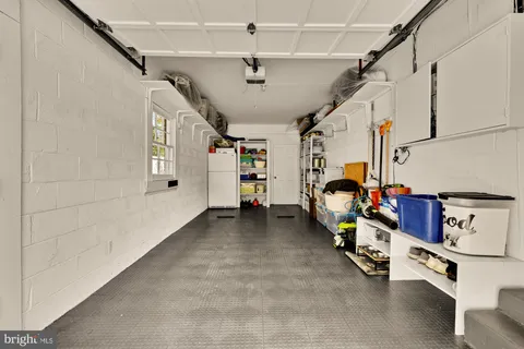 a view of backyard of house with green space