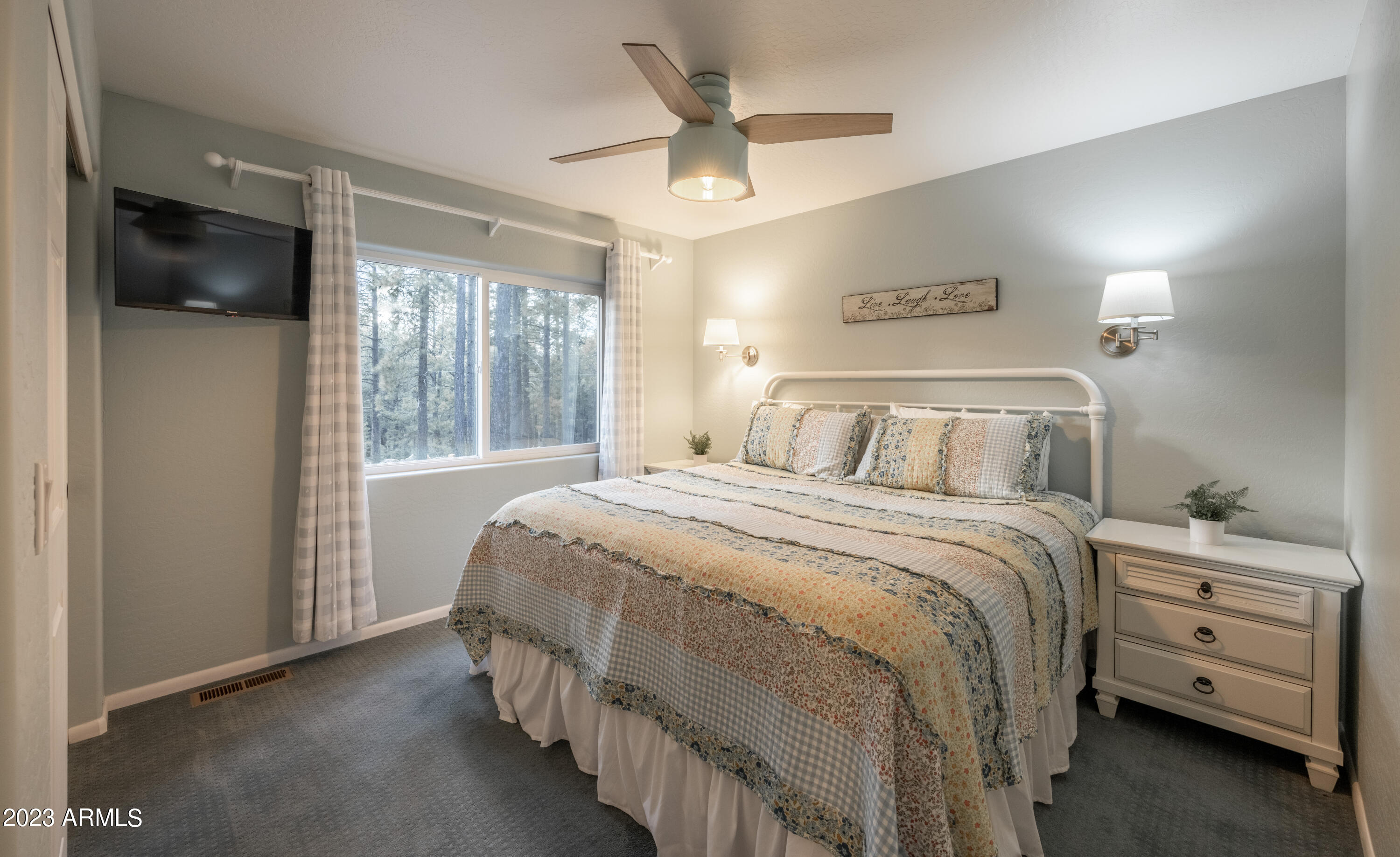 2772 Larson Loop Forest Lakes, AZ 85931 - Photo 22 of 65 a bedroom with a bed and a large window