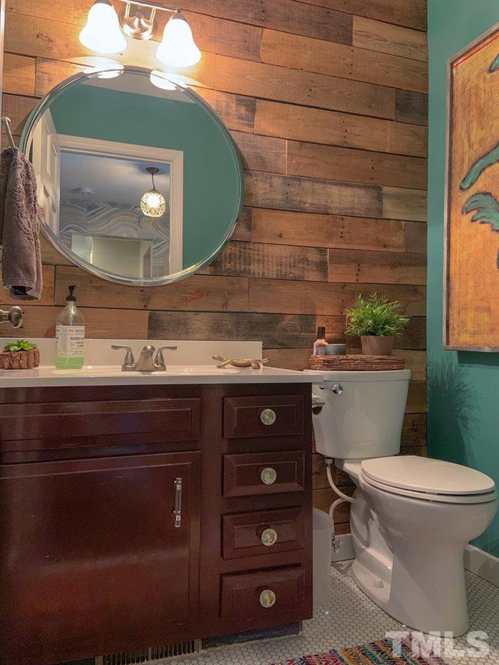 8709 Sleepy Creek Drive Raleigh, NC 27613 - Photo 14 of 28 Downstairs powder room with Pallet wall